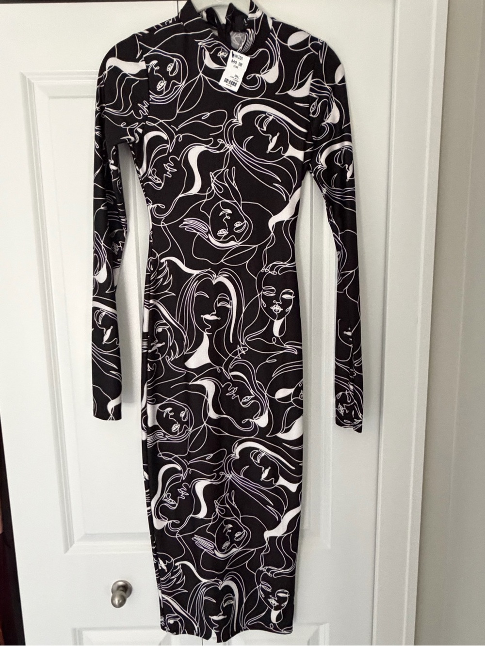 AKIRA Black & White Abstract Faces Long Sleeve Midi Dress